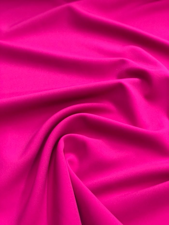 pexels photo 14856449 Close-up of a vibrant pink fabric showcasing soft waves and subtle folds
